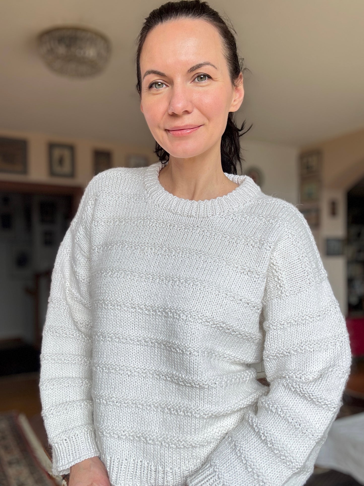 Julia Piro wearing The Artist’s Sweater in cream with textured stripes.