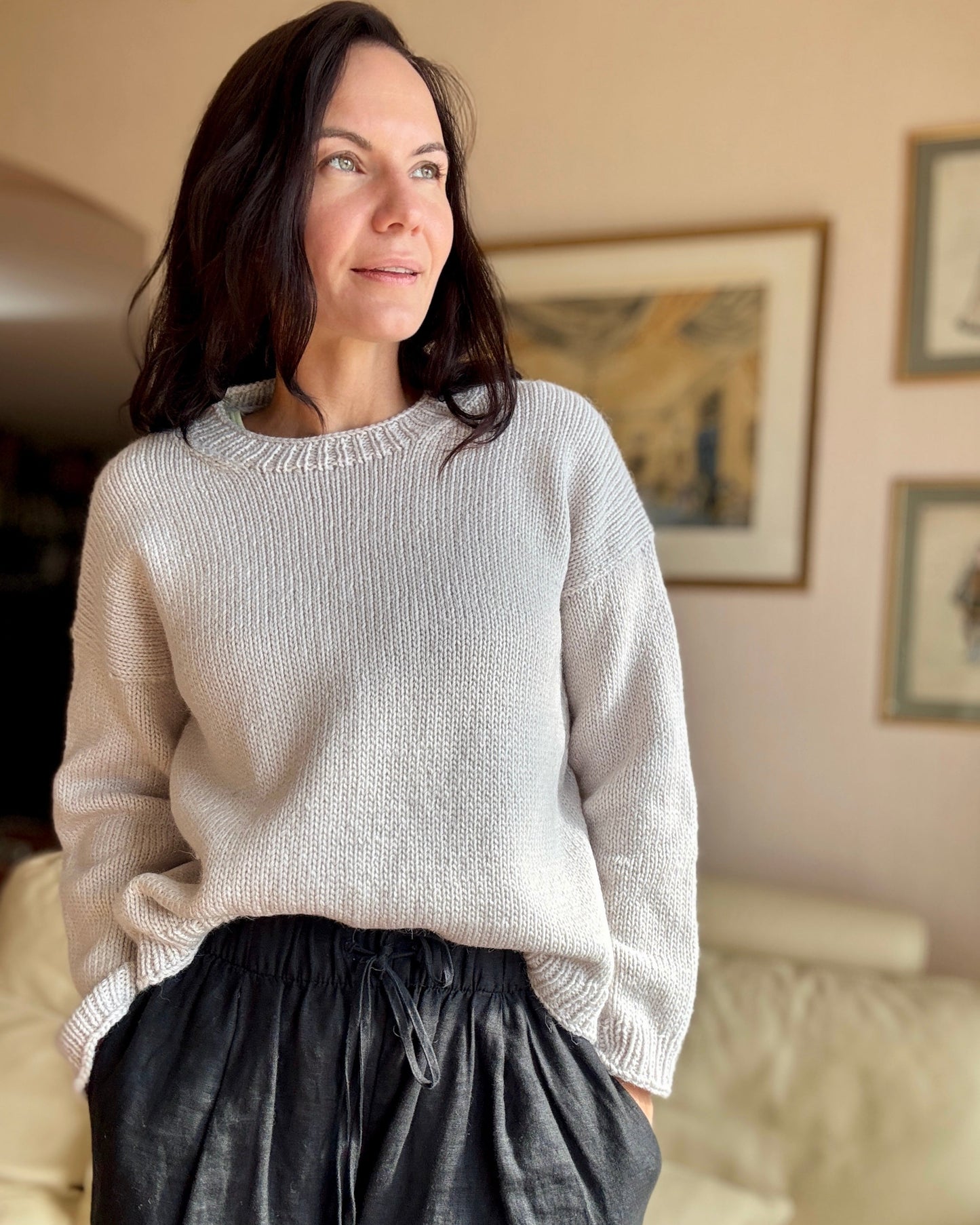 Julia Piro wearing the hand-knit Drop in Dream sweater in chalk paired with black drawstring pants
