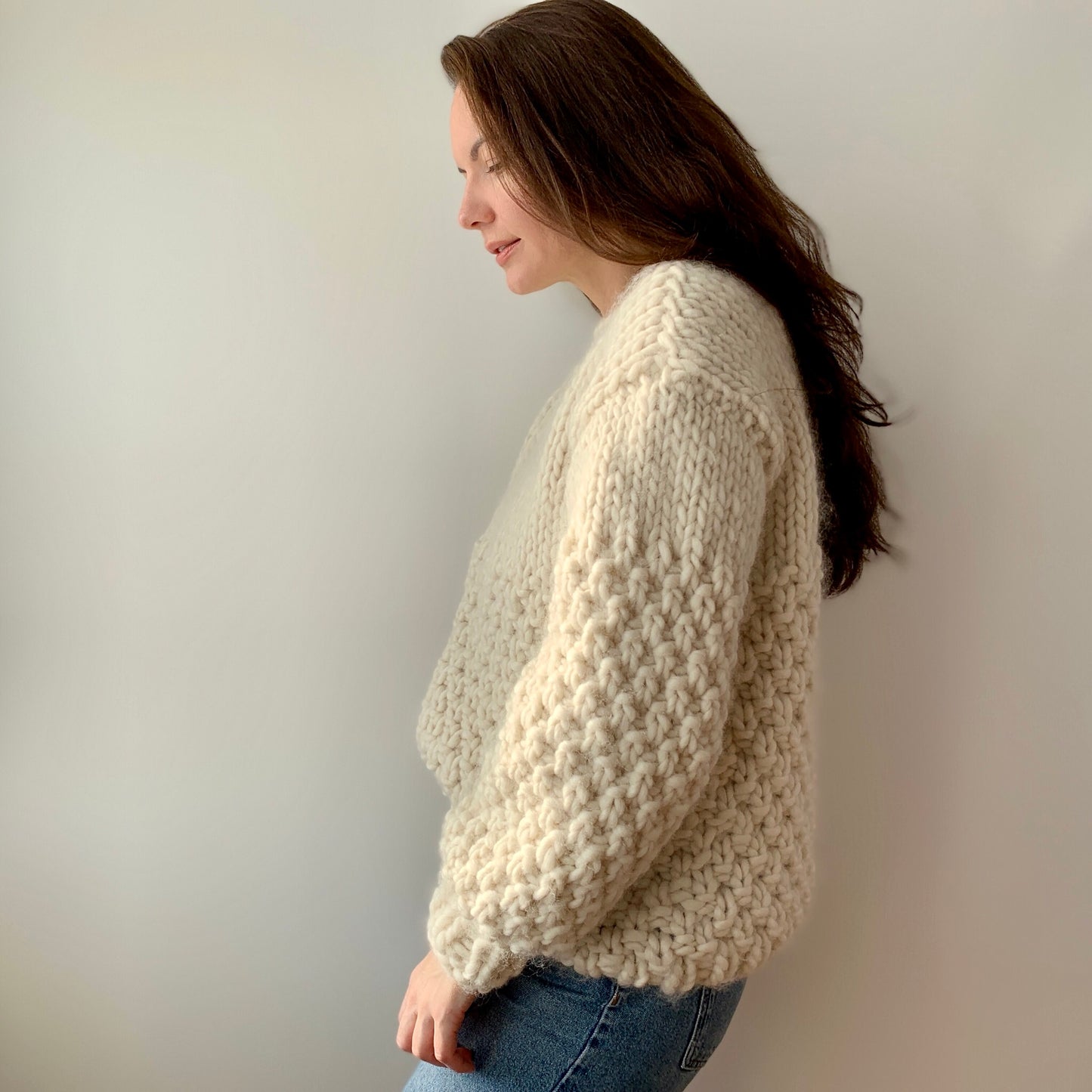 Julia Piro in a side profile view wearing the Frosty Sweater