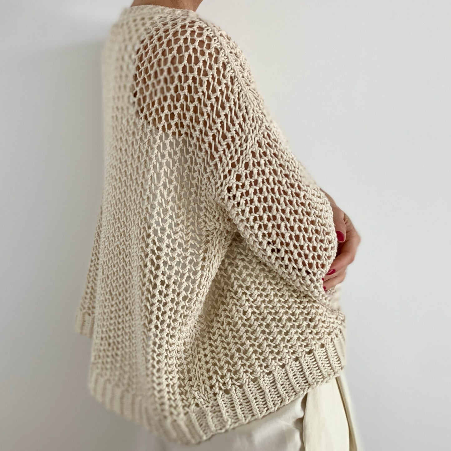 Side view of a woman wearing the Halycon Lace Sweater