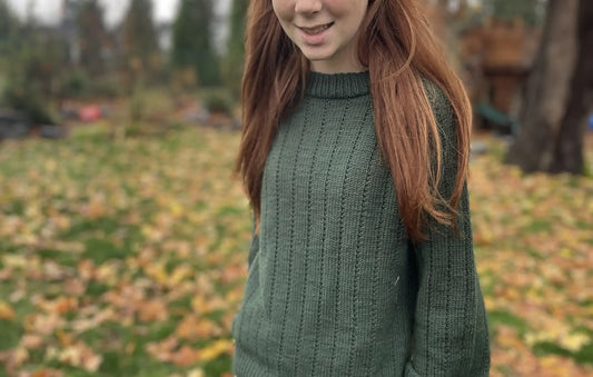Woman wearing the Weekend Glow Sweater in dark green