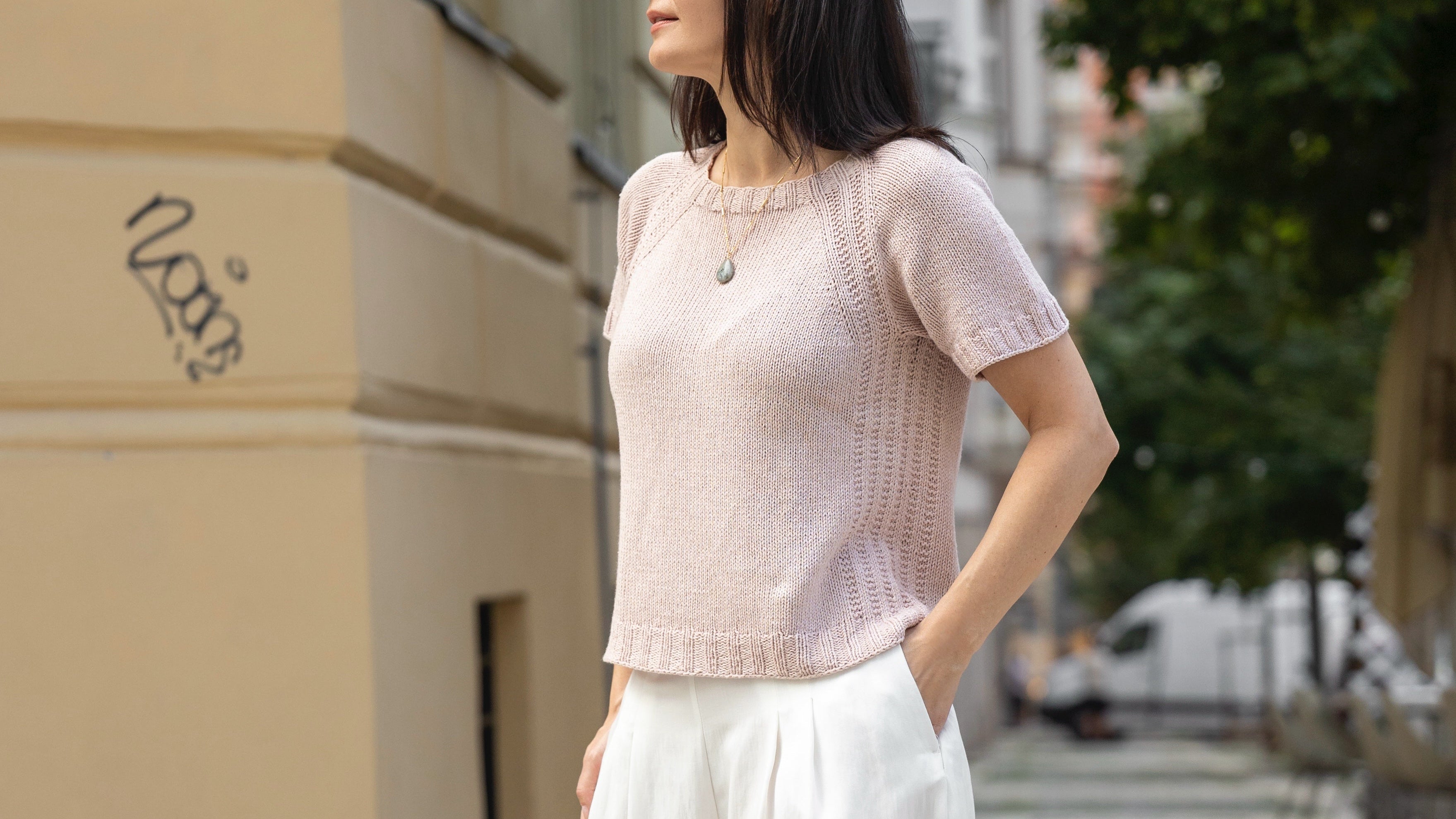 woman wearing a pink knitted  top